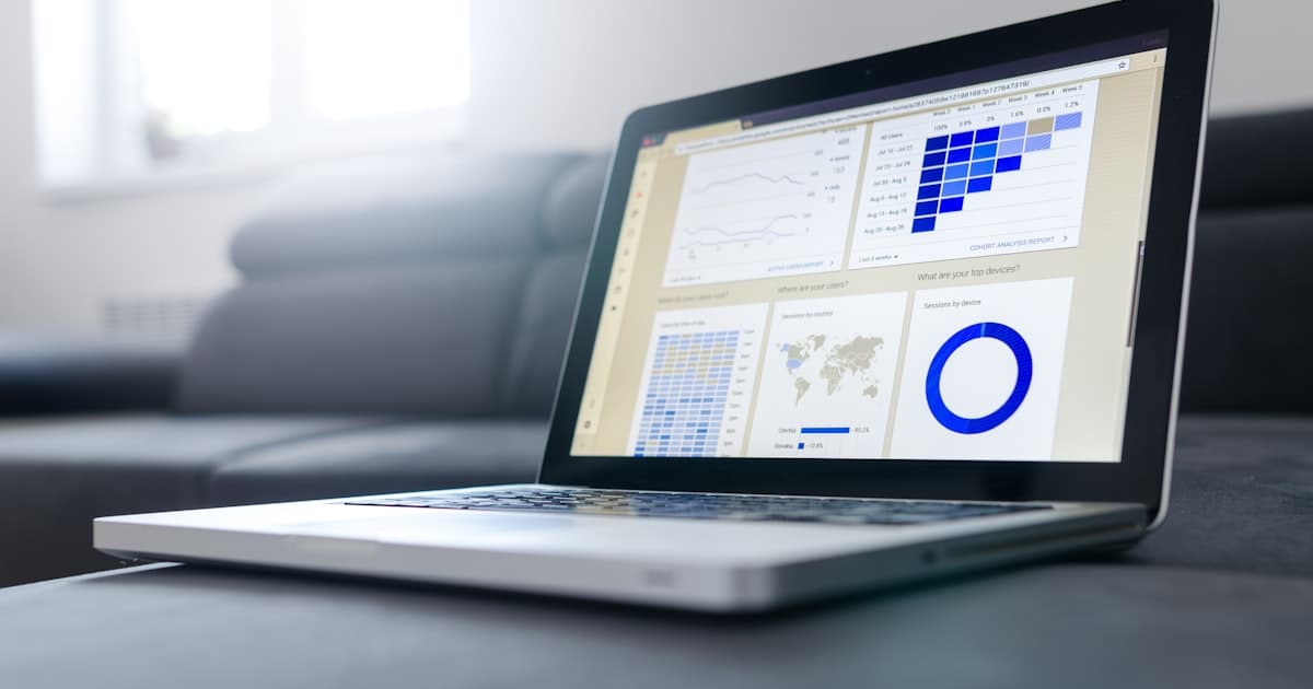 E-commerce manager reviewing competitive intelligence dashboard with price alerts and competitor analysis
